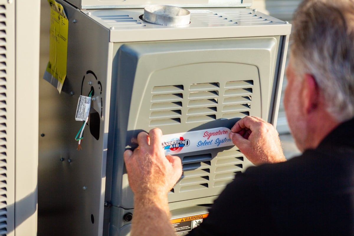 Vanderford Air and Plumbing technician installing a ductless mini split head in a League City, TX home