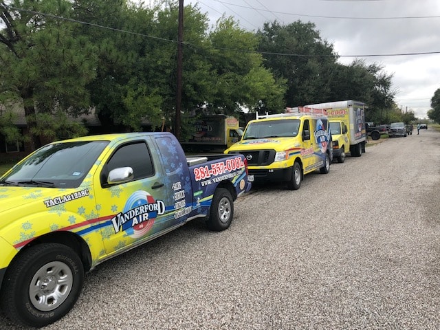 Vanderford Air and Plumbing crew setting a new condenser during an AC installation at a home in Webster, TX.